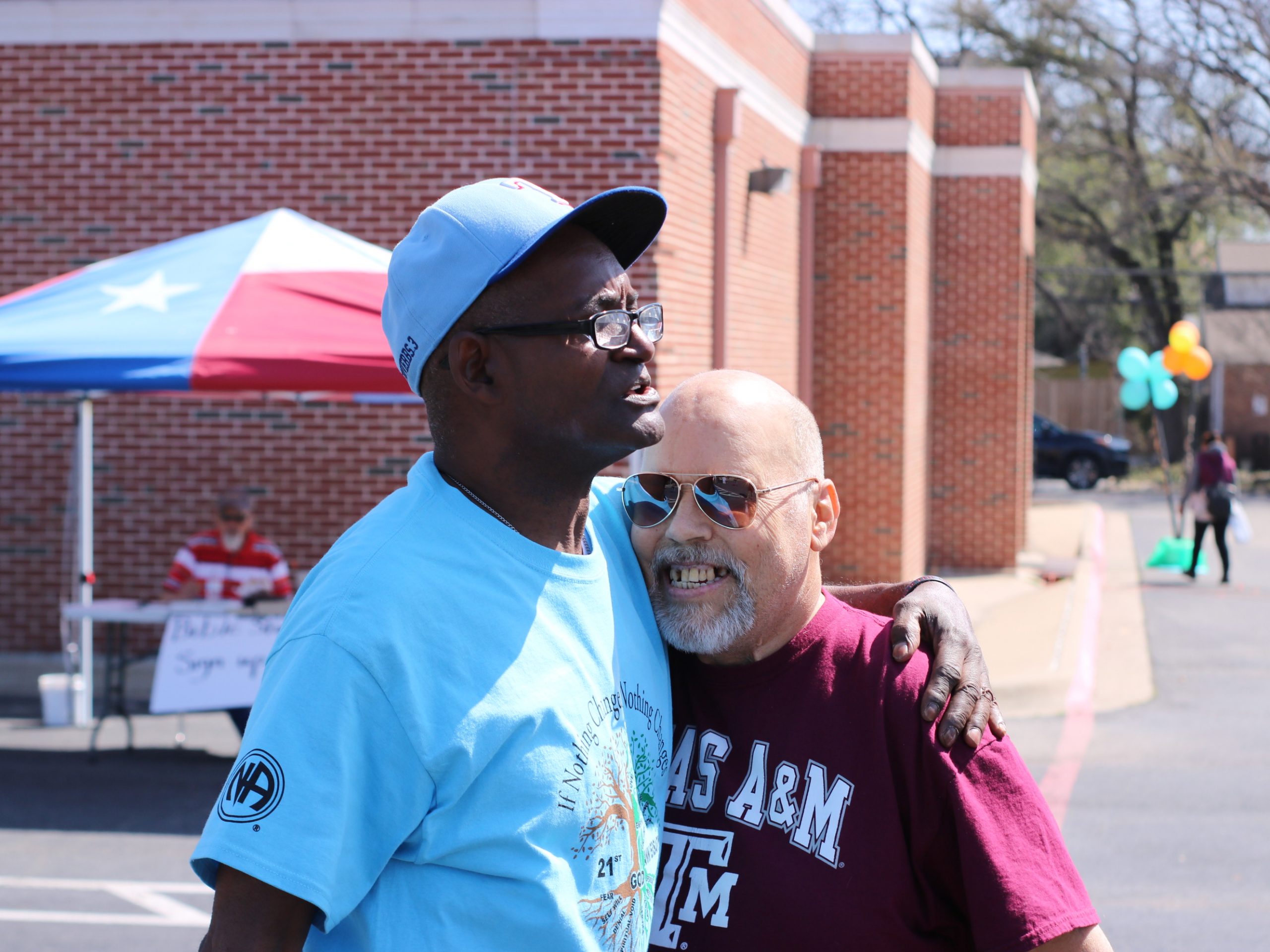 Two Partners in the Gospel embrace, celebrating H.O.P.E.